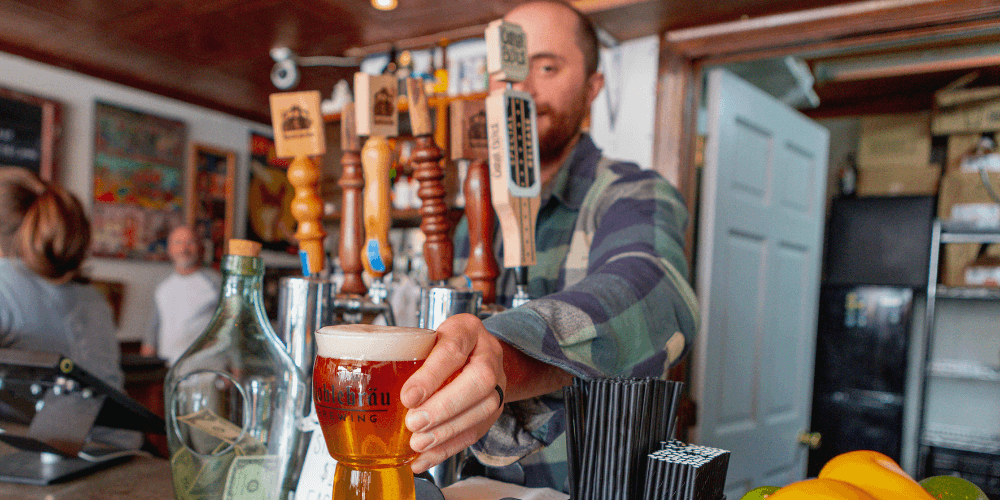 Serving up a beer at Noblebräu Brewing in the Lumberyard district near Downtown Brevard.