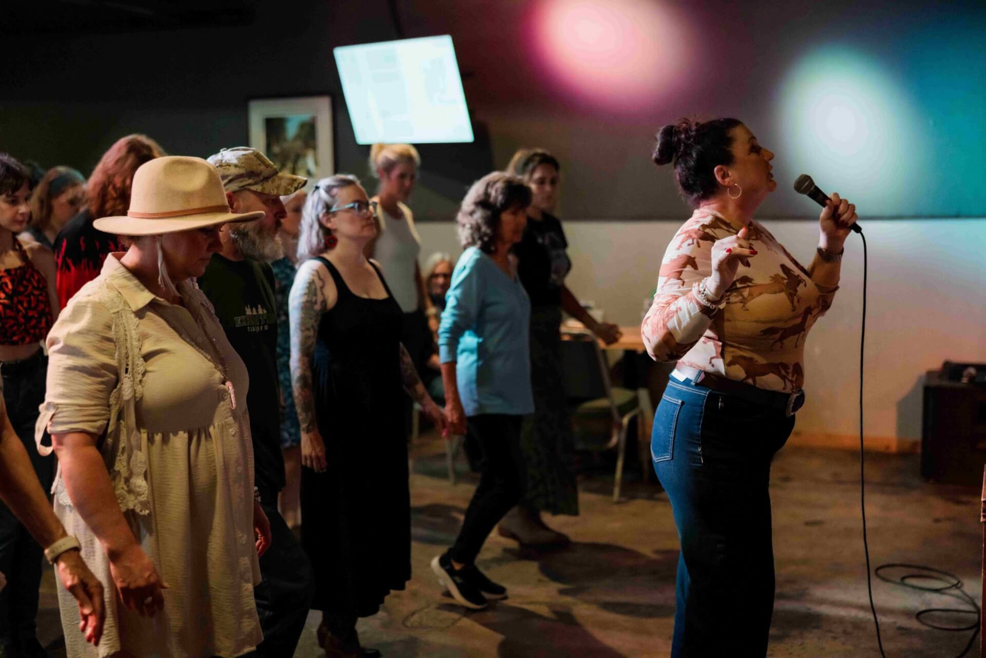 Instructor leads line dancers during Honky Tonk Thursday at 185 King Street