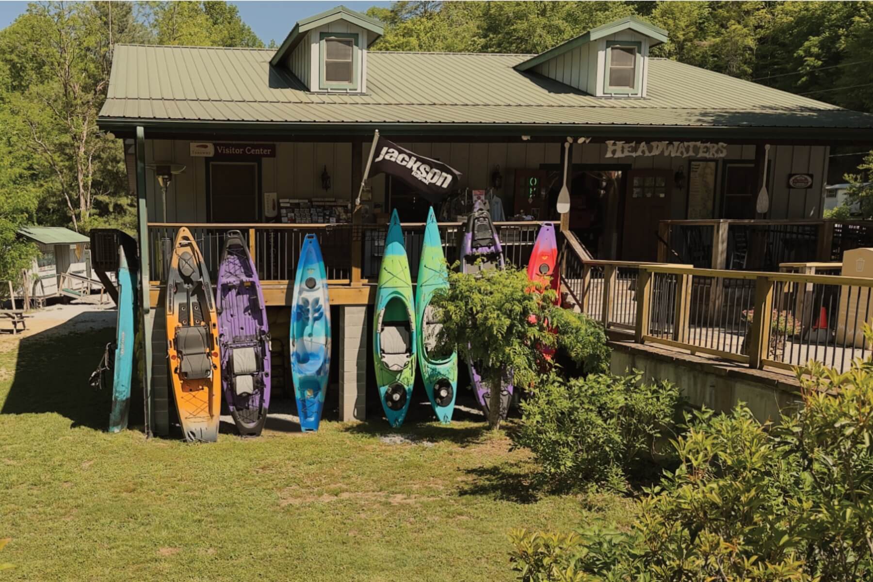Kayaks leaned against the front of Headwaters Outfitters shop